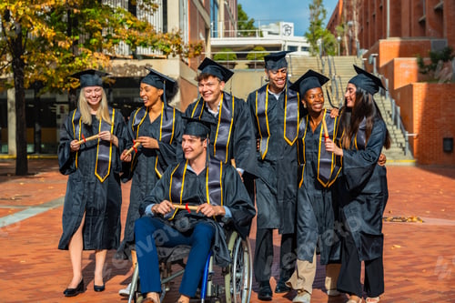 Preview: Diverse graduates celebrating academic achievement on university campus