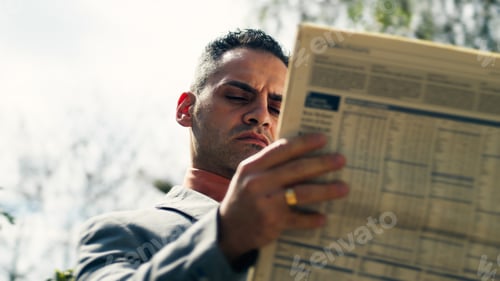 Preview: Reading The Newspaper outdoor at sunlight