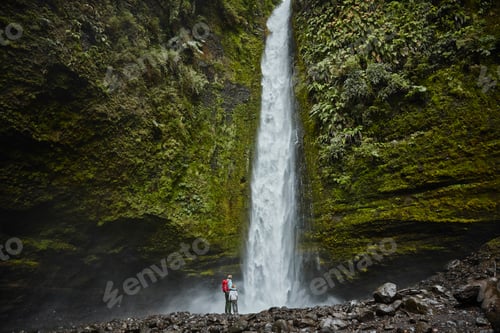 Preview: Chile, Patagonia, Osorno Volcano, mother and son standing at Las Cascadas waterfall