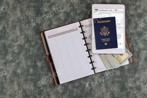 Preview: IRS form 1040 with individual income tax return of dollar bills