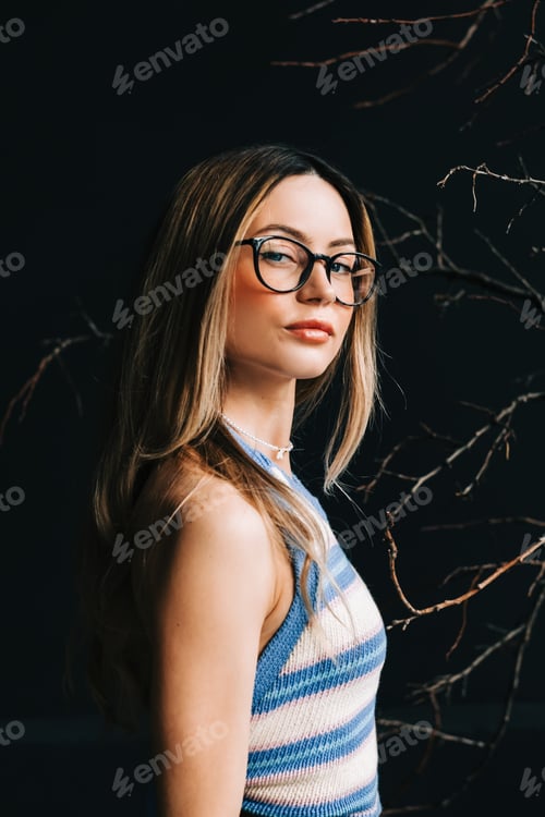 Preview: Portrait of young attractive caucasian woman in eyeglasses.