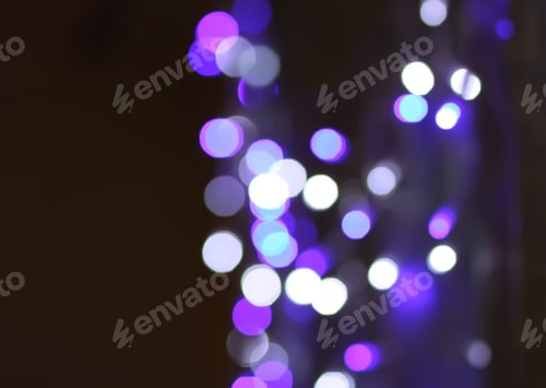 Preview: Abstract bokeh background. Blurred garland lights.