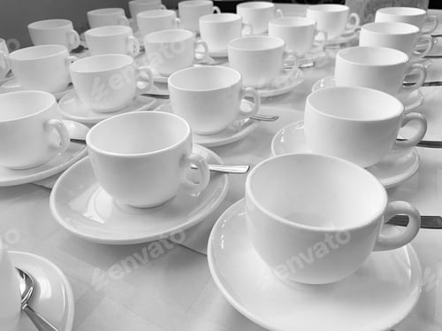 Preview: Many rows of white ceramic coffee or tea cups. Lines of coffee cups