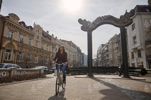 Preview: One Young Woman, 20-29 Years Old, Riding A Retro Old Bicycle On A Old City European Square