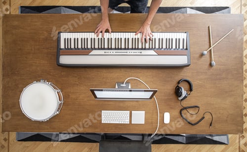 Preview: Top view of musician in the process of recording music in the studio.