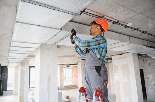 Preview: Arab engineer installing air conditioning system on construction site