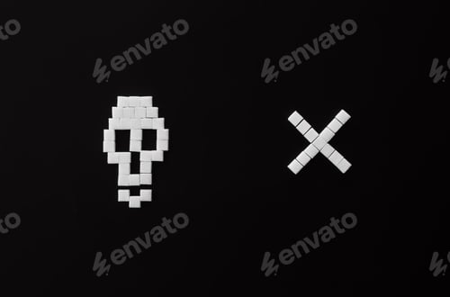 Preview: Skull bones from sugar on black background, flat lay.