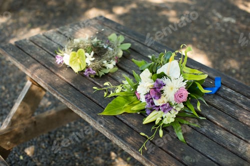 Preview: wedding bouquet and wreath on a wooden table