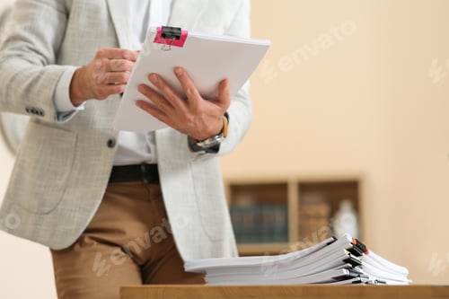 Preview: Man working with documents in office, closeup. Space for text