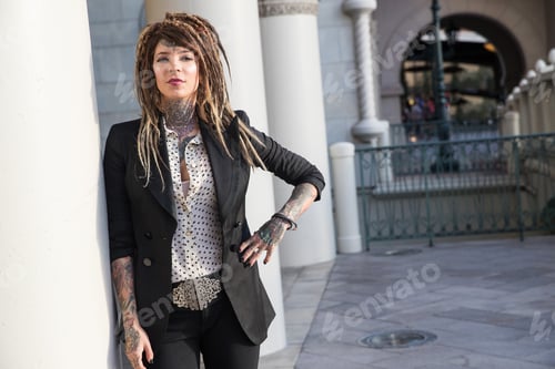Preview: Smart, successful business woman with tattoos and dreadlocks
