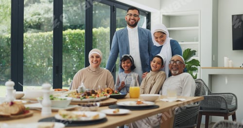 Preview: Eid, portrait and smile of family at table in dining room of home together for muslim celebration.