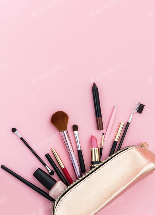 Preview: Make-up cosmetic bag against pink background, copy space