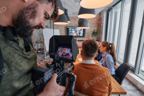 Preview: Capturing Corporate Dynamics: Videographer Films Business Meeting in Modern Office.