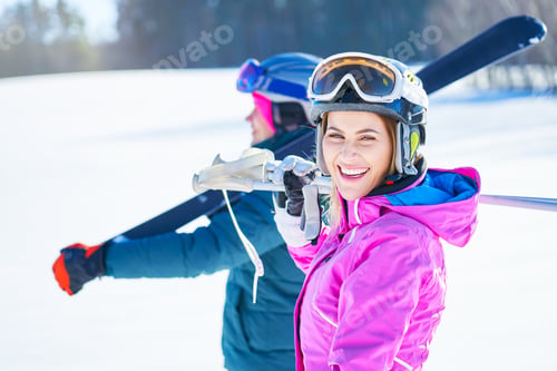 Preview: Young couple having fun while winter skiing