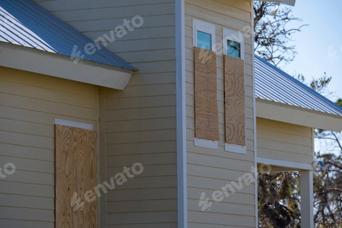 Preview: Plywood storm shutters for hurricane protection of house windows.