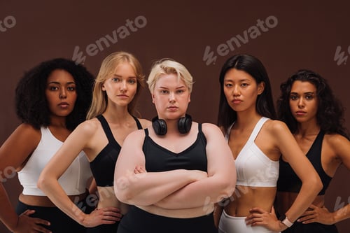Preview: Five confident women in sportswear standing together