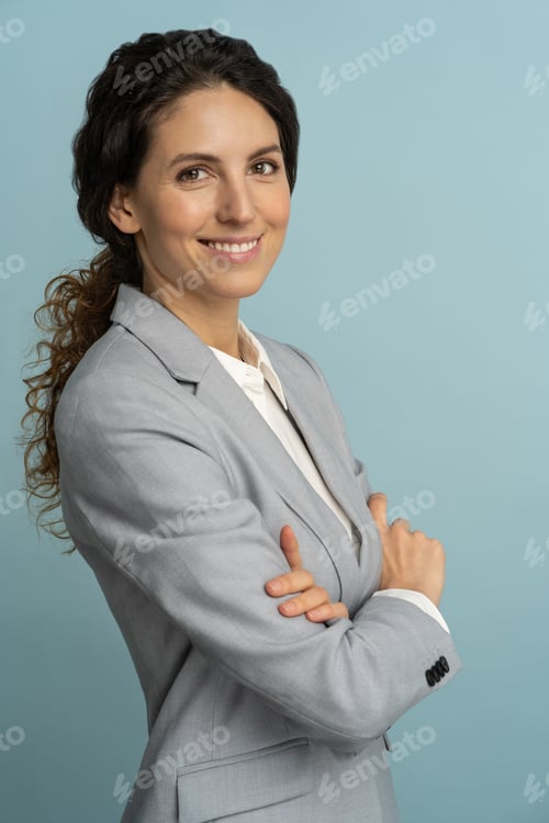 Preview: Confident businesswoman, smiling, looking at camera posing isolated on blue background. Side view.