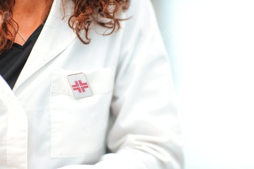 Preview: Medical Professional in Lab Coat with Emblem