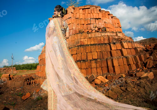 Preview: Beautiful Indian bride on bricks background