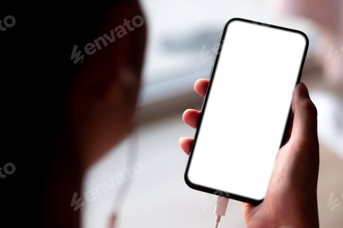 Preview: Close up Woman hand Using a Smart Phone with earbuds at cafe coffee shop.