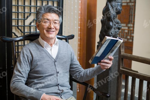 Preview: Senior man reading book
