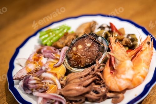 Preview: People Eat Plate Of Seafood On Table In A Restaurant