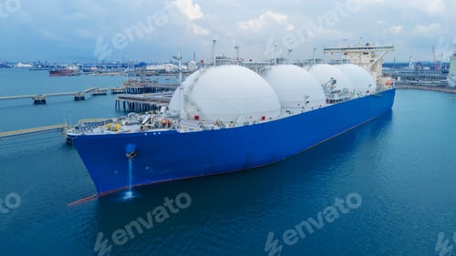 Preview: LNG (Liquified Natural Gas) tanker anchored in Gas terminal gas tanks for storage.