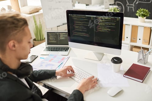 Preview: Young Web Developer Writing Code