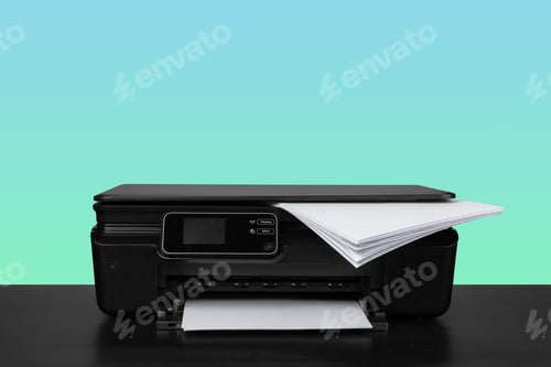 Preview: Home laser printer on desk against green background