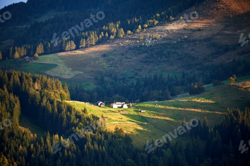 Preview: Rural scene with small farmhouse bathed in soft light of late afternoon.