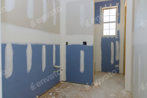 Preview: A newly constructed house is in the process of being plastered and the drywall is ready for painting