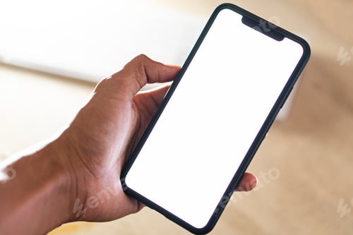 Preview: Close-up of a businessman hand holding a smartphone white screen