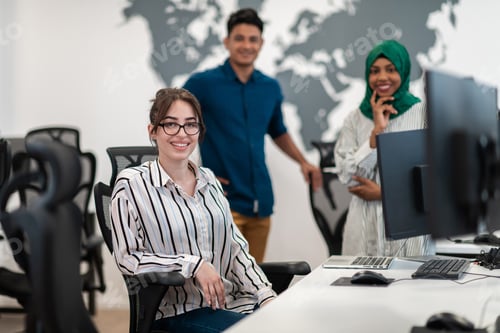 Preview: Multiethnic startup business team Arabian woman wearing a hijab on meeting in modern open plan