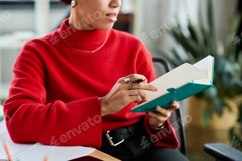 Preview: Young Black businesswoman brainstorms creatively in a modern workspace