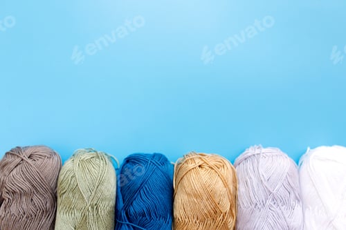 Preview: Skeins of wool yarn and knitting needles