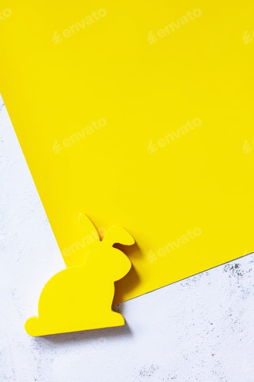 Preview: Minimal Easter concept. Bunny on yellow and gray background.