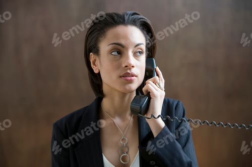 Preview: Young woman talking on phone