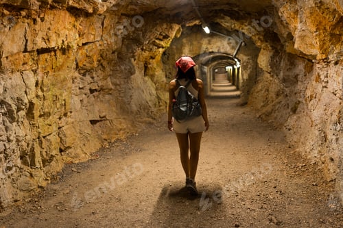 Preview: Woman exploring Gric tunnel Rijeka embarking on adventure