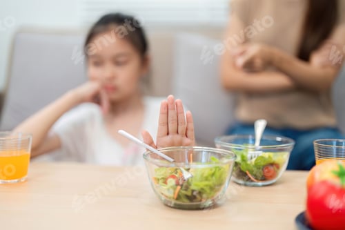 Preview: Wellness: Child refusing to eat healthy salad during mealtime