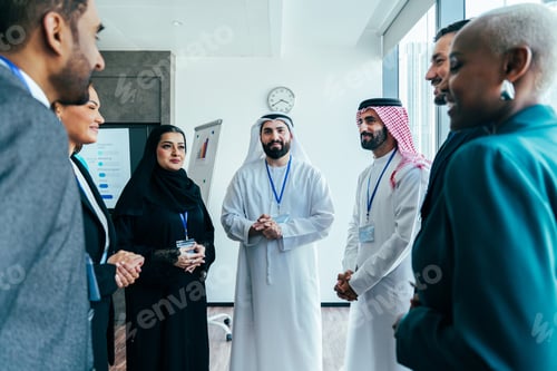 Preview: Multiethnic business team meeting in dubai office discussing corporate strategy