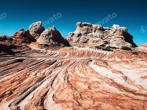 Red rock formation against blue sky
