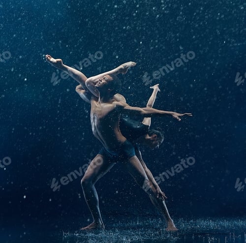 Preview: Young couple of ballet dancers dancing unde rwater drops