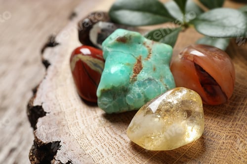Preview: Citrine quartz and beautiful gemstones on wooden stand, closeup