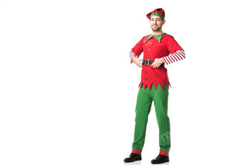 Preview: smiling man in christmas elf costume looking at camera with hands on hips isolated on white