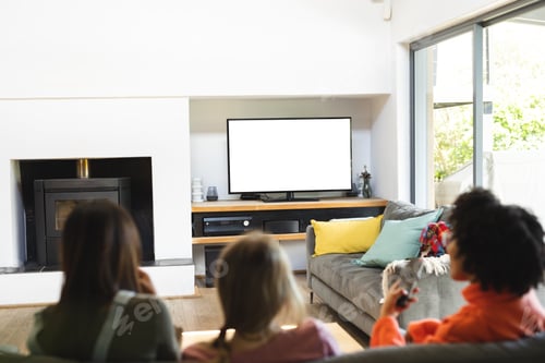 Preview: Diverse teenage female friends watching tv with copy space