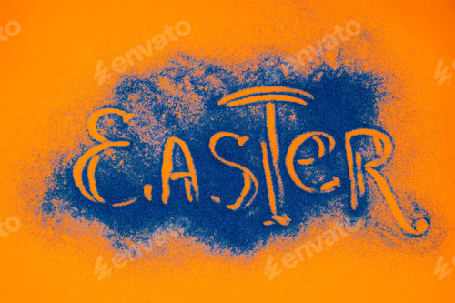 Preview: top view of easter sign made of blue sand on orange surface
