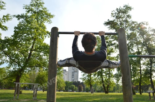 Preview: Young man exercising in park