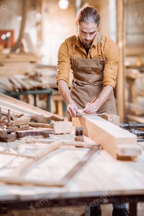 Preview: Carpenter working with a wood in the workshop