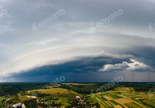 Preview: Landscape of dark clouds forming on stormy sky during thunderstorm over rural area