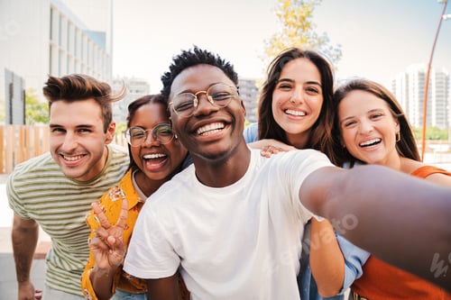 Preview: Group of multiracial young student people smiling and taking a selfie together. Close up portrait of